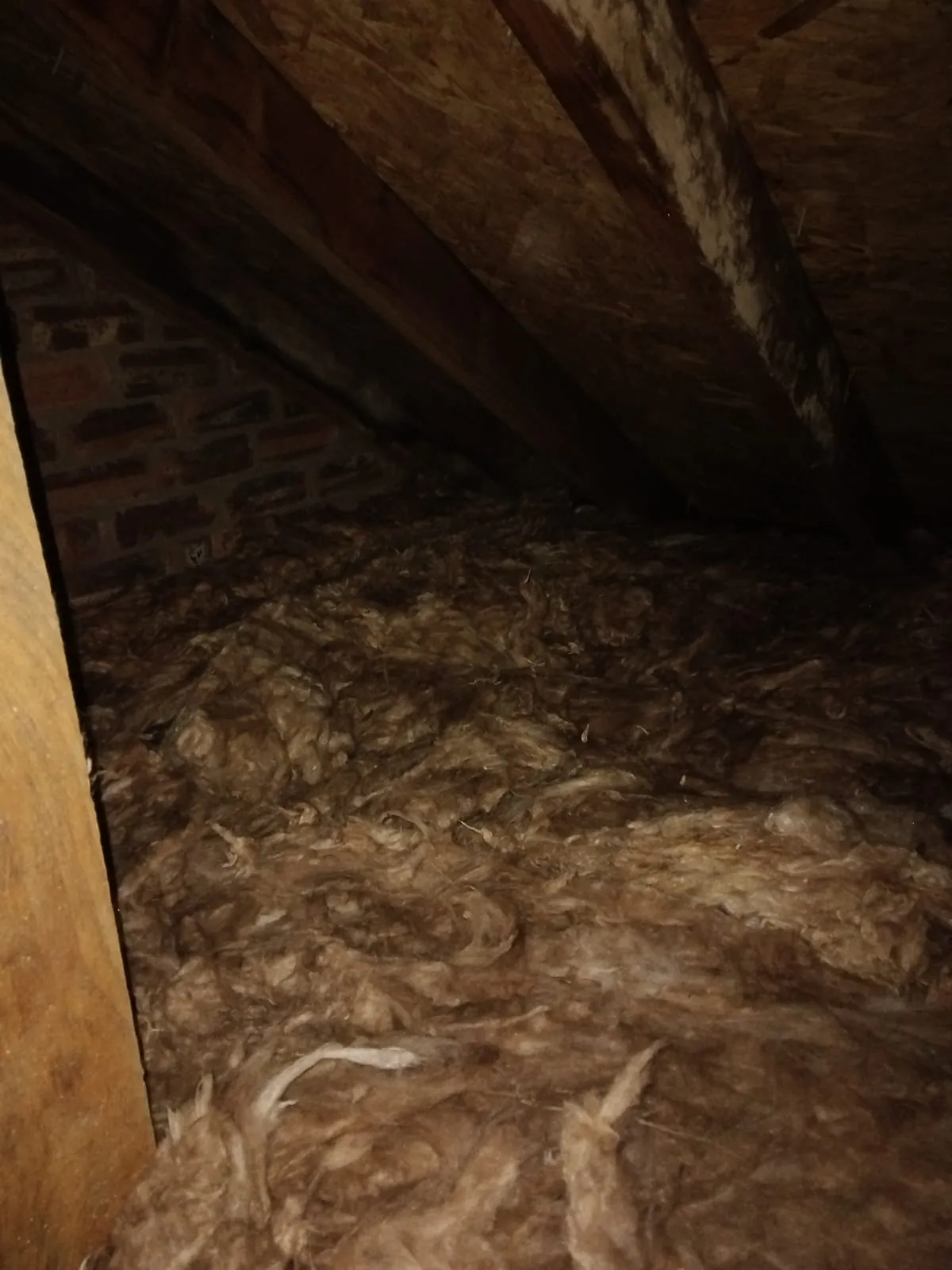 Completed mineral wool insulation coverage beneath the roof timbers in Crossmyloof, Glasgow