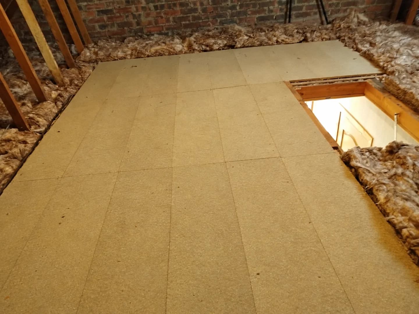 New loft boarding surrounded by Knauf mineral wool insulation in Kilwinning